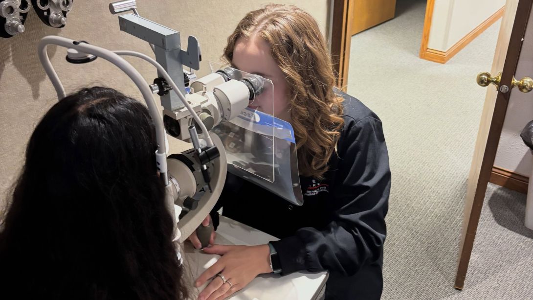 Claire Husen examining a patient 